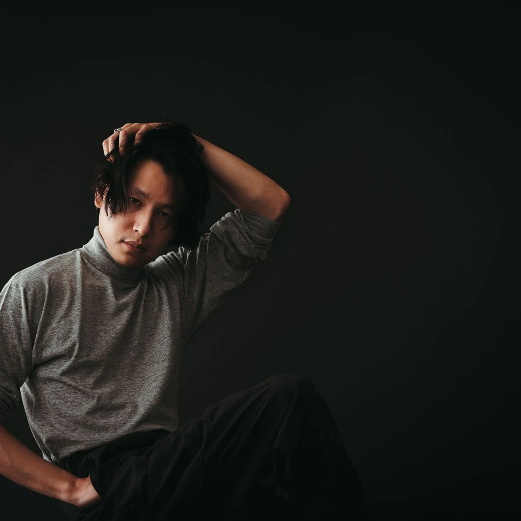 Theo Park, Creative Director and Co-Founder, photographed in the Lisbon satellite studio with a printed storyboard.